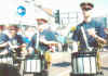 In hot weather, some bandsmen discard their heavy tunics.