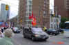 people stop to see the Toronto procession pass by.